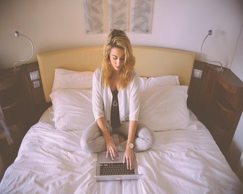 A person comfortably working on a laptop at home in Mexico